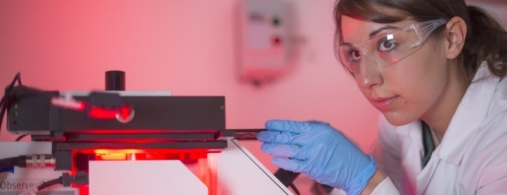 Student analysing research in a laboratory