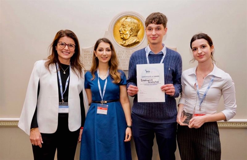 Four students accepting an award